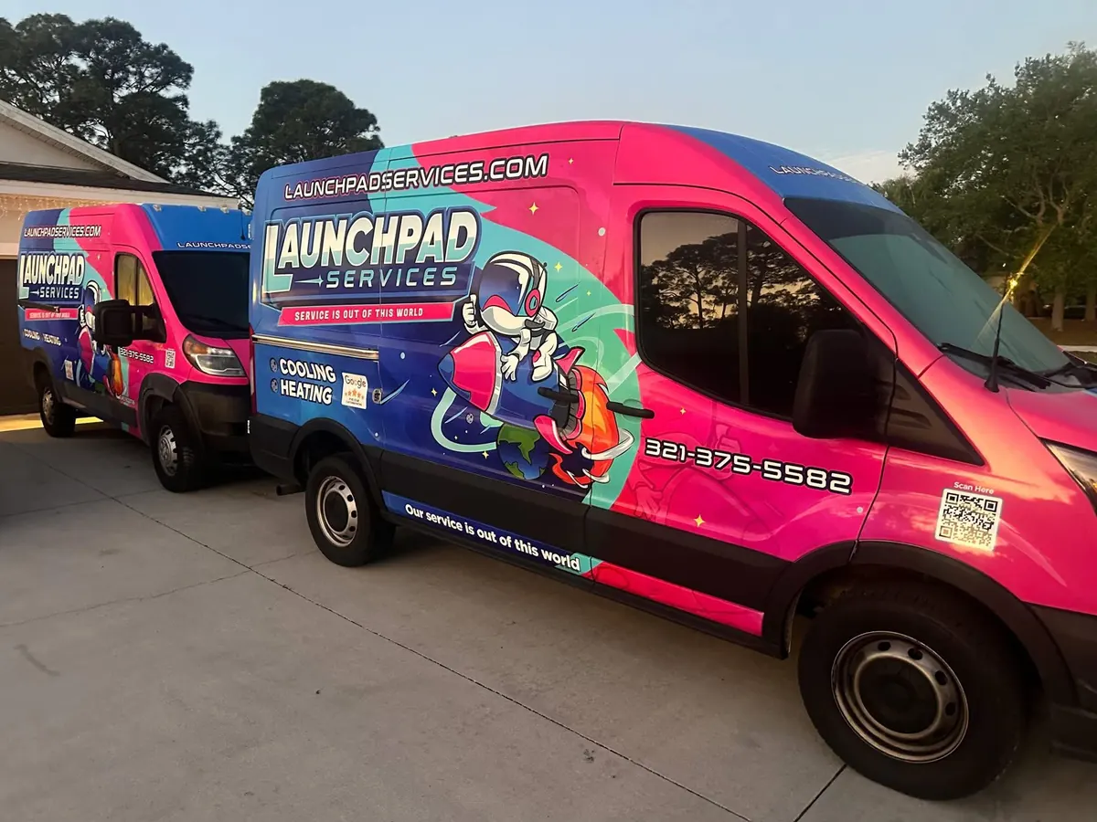 Launchpad Services wrapped service vans lined up and ready for calls in Palm Bay, Florida